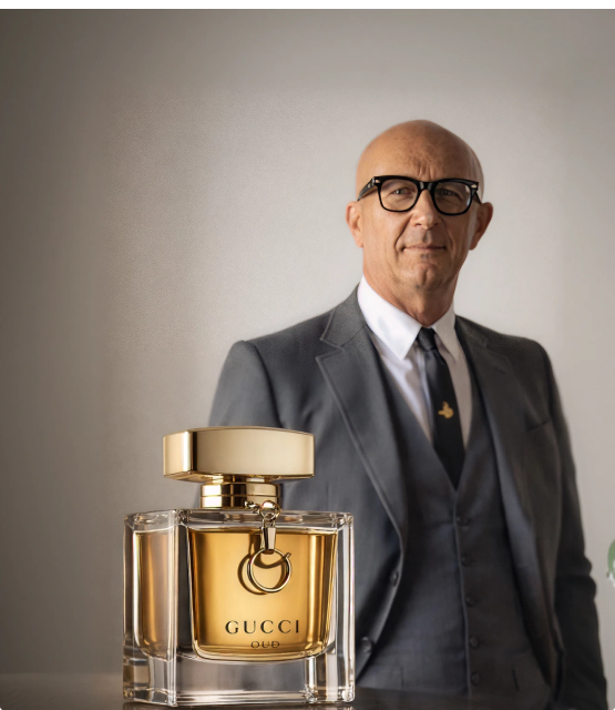 Marco Bizzarri, former president and CEO of Gucci, with a Gucci fragrance bottle.